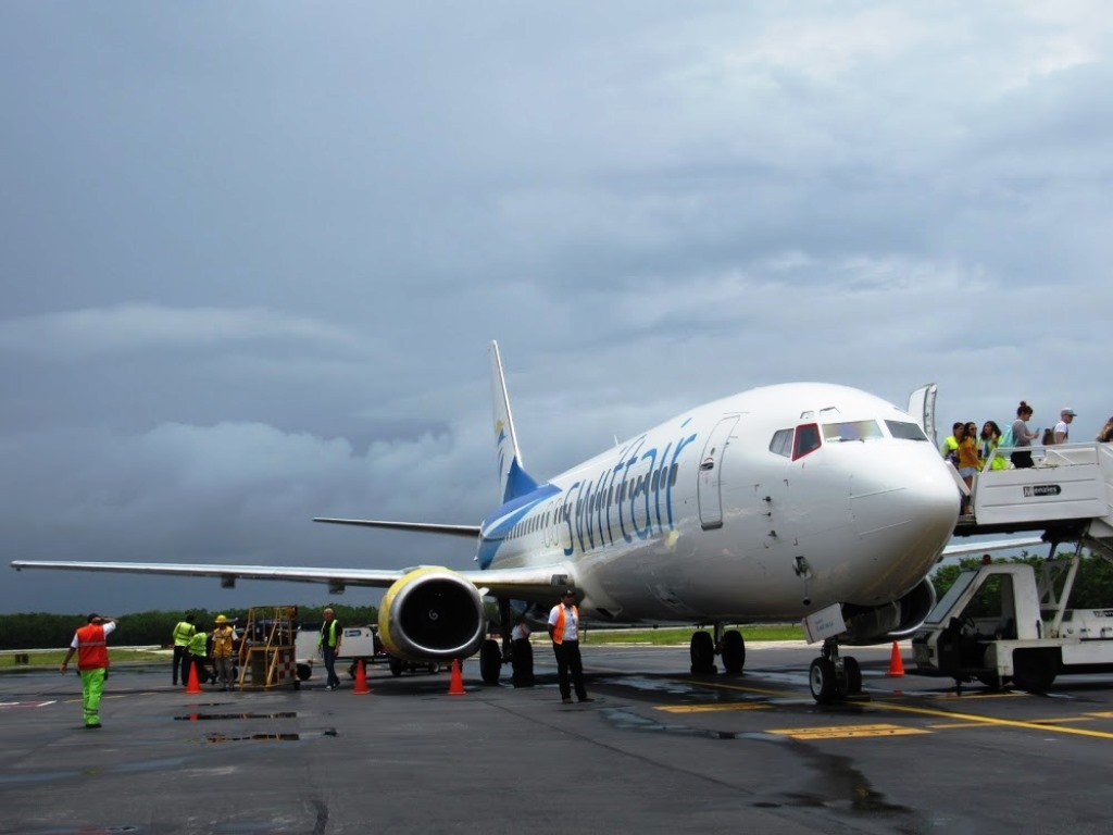 Transportistas esperan regreso de vuelos canadienses al aeropuerto de Cozumel