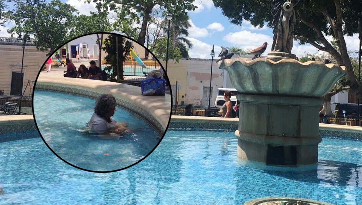 Mujer se refresca en la fuente del parque de San Juan en Mérida: FOTO