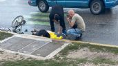 Ciclista cae en una coladera abierta y queda inconsciente en Cancún